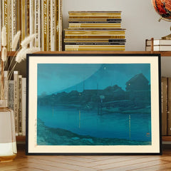 Omori Coast by Hasui Kawase print framed on a living room bookshelf