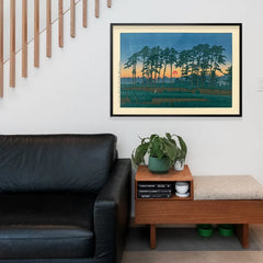 Setting Sun by Hasui Kawase, Japanese woodblock print framed above a living room sofa