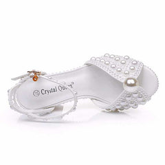 White chunky wedding sandals with pearl embellishments for a stylish bridal look