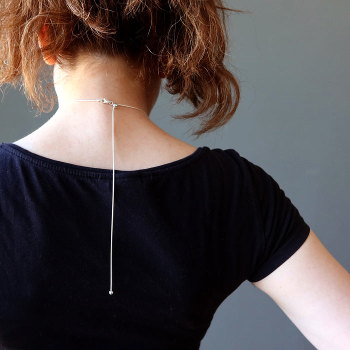 back of female model showing adjustable snake chain
