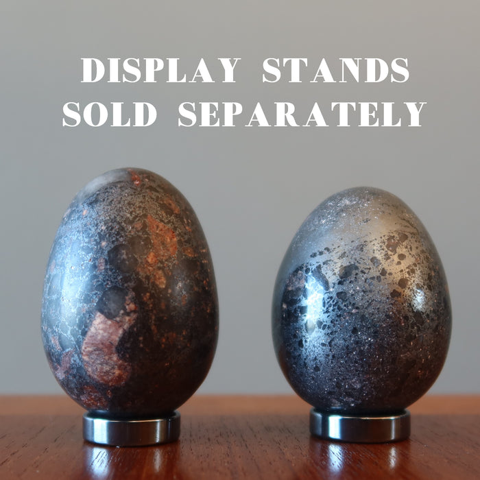 two hematite eggs on display stands which are sold separately