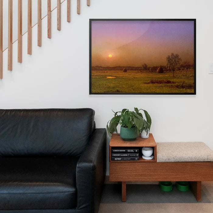 Marsh Sunset Print by Martin Johnson Heade, fine art poster framed above a living room sofa