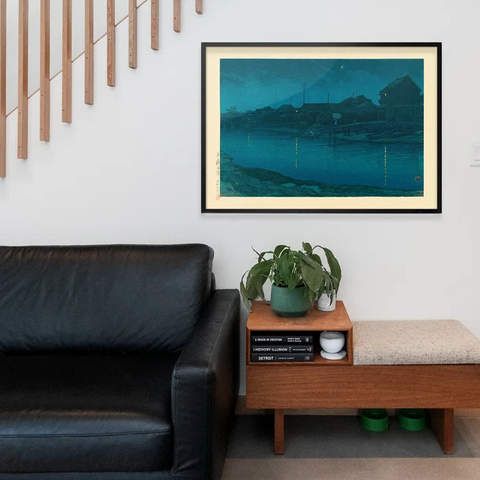 Omori Coast by Hasui Kawase, Japanese woodblock print framed above a living room sofa