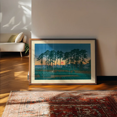 Setting Sun by Hasui Kawase print framed, leaning on a wooden floor beside a rug